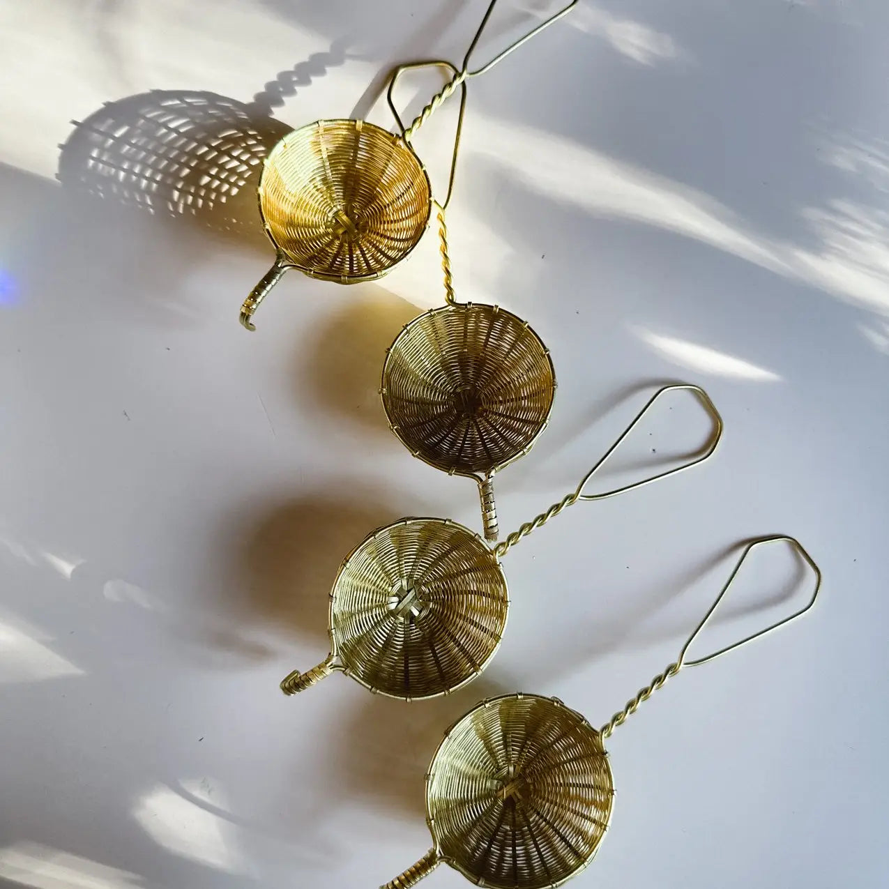 Woven brass tea strainer